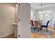 Dining room with decorative rug, a pendant light and natural light coming through the glass doors at 9624 Scarborough Ct, Summerville, SC 29485