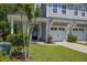 Charming gray townhome with covered front porch, two-car garage, and manicured lawn at 9624 Scarborough Ct, Summerville, SC 29485