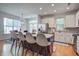 Bright open kitchen featuring stainless steel appliances and marble countertops with bar stool seating at 9624 Scarborough Ct, Summerville, SC 29485