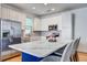 Stylish kitchen with white cabinets, stainless steel appliances, and marble island at 9624 Scarborough Ct, Summerville, SC 29485