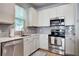 Modern kitchen featuring stainless steel appliances, light gray subway tile backsplash, and marble counters at 9624 Scarborough Ct, Summerville, SC 29485