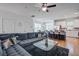 Open-concept living room showcasing modern furnishings, hardwood floors, and abundant natural light at 9624 Scarborough Ct, Summerville, SC 29485