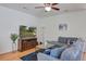 Comfortable living room featuring a sectional sofa, modern TV, and decorative accents at 9624 Scarborough Ct, Summerville, SC 29485