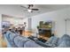 Open-concept living room with modern furnishings, kitchen, and bright natural light at 9624 Scarborough Ct, Summerville, SC 29485