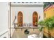 Charming balcony featuring arched doors, iron railings, and seating for enjoying outdoor views at N Blvd, Mount Pleasant, SC 29464