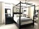 Elegant bedroom with a four-poster bed, soft lighting, and a calming, neutral color palette at N Blvd, Mount Pleasant, SC 29464
