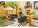 Beautiful courtyard with a fountain, stone pavers, comfortable seating, palm trees, and manicured plants at N Blvd, Mount Pleasant, SC 29464