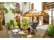 Relaxing courtyard boasting a seating area, potted plants, palm trees, and an inviting umbrella for shade at N Blvd, Mount Pleasant, SC 29464