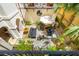 Inviting courtyard with stone pavers, comfortable seating, lush greenery, and a charming umbrella-covered table at N Blvd, Mount Pleasant, SC 29464