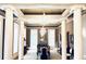 Formal dining room featuring elegant columns, a chandelier, and classic decor for upscale entertaining at N Blvd, Mount Pleasant, SC 29464