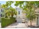 Exterior features a well-manicured lawn, driveway, and white facade with lush greenery and golf cart at N Blvd, Mount Pleasant, SC 29464