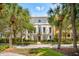 Stately home exterior featuring an elegant facade, mature trees, and a meticulously landscaped lawn at N Blvd, Mount Pleasant, SC 29464