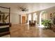 Spacious indoor space with fan, travertine tile flooring, interior and exterior entrances, and arched doorways at N Blvd, Mount Pleasant, SC 29464