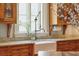 Cozy kitchen featuring wood cabinets, countertops, a farmhouse sink, and natural light at N Blvd, Mount Pleasant, SC 29464