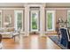 Elegant living room featuring hardwood floors, large windows, and decorative columns for an open feel at N Blvd, Mount Pleasant, SC 29464