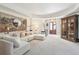 Bright living room featuring a cozy sectional sofa, a chic round mirror, and stylish decor at N Blvd, Mount Pleasant, SC 29464