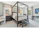 Elegant main bedroom with a four-poster bed, plush carpeting, and large windows offering ample natural light at N Blvd, Mount Pleasant, SC 29464