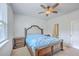 Comfortable bedroom featuring a ceiling fan, a neutral color scheme, and wood furniture at 1003 Peridote Way, Ladson, SC 29456