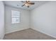 Bedroom featuring a ceiling fan and a window with a view of the neighborhood at 1003 Peridote Way, Ladson, SC 29456