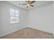 Bedroom with a ceiling fan and a window with a view of the neighborhood at 1003 Peridote Way, Ladson, SC 29456