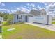 Charming single-story home with a well-maintained lawn and a private driveway at 1003 Peridote Way, Ladson, SC 29456