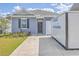 Inviting single-story home featuring a well-kept front yard, driveway, and welcoming entrance at 1003 Peridote Way, Ladson, SC 29456