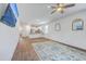 Open living room featuring wood-look flooring and seamless flow into the kitchen area at 1003 Peridote Way, Ladson, SC 29456