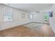 Bright and open living room with wood-look floors and plenty of natural light at 1003 Peridote Way, Ladson, SC 29456