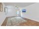 Spacious living room with access to outdoor patio and modern ceiling fan at 1003 Peridote Way, Ladson, SC 29456