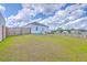 Spacious backyard featuring a lush lawn and a wooden fence, perfect for outdoor enjoyment at 1011 Peridote Way, Ladson, SC 29456