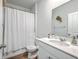 Clean bathroom with a shower-tub combo, white vanity, and ample countertop space at 1011 Peridote Way, Ladson, SC 29456