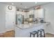 Well-lit kitchen with stainless steel appliances, granite countertops, and barstool seating at 1011 Peridote Way, Ladson, SC 29456