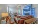 Cozy living room featuring leather furniture and a modern blue accent wall with a built-in fireplace at 1011 Peridote Way, Ladson, SC 29456