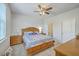 Comfortable main bedroom with natural light, ceiling fan, and ensuite bathroom at 1011 Peridote Way, Ladson, SC 29456
