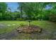Large backyard featuring a birdbath, landscaping, and a stone path leading to seating at 1035 Planters Curve, Mount Pleasant, SC 29464