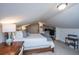 Attic bedroom with unique ceiling, bed, desk, and storage solutions at 1035 Planters Curve, Mount Pleasant, SC 29464
