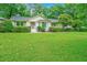 Charming home with a lush green lawn and well-manicured landscaping at 1035 Planters Curve, Mount Pleasant, SC 29464