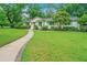 Charming home with a lush green lawn, walkway, and well-manicured landscaping at 1035 Planters Curve, Mount Pleasant, SC 29464