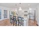 Bright kitchen with a marble island, stainless steel appliances, and modern fixtures at 1035 Planters Curve, Mount Pleasant, SC 29464