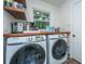 Modern laundry room with Samsung washer and dryer set and wooden countertops at 1035 Planters Curve, Mount Pleasant, SC 29464