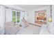 Inviting living room with large windows, plush seating, and a view into an adjacent room with built-in shelves at 1035 Planters Curve, Mount Pleasant, SC 29464