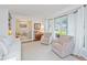 Bright living room with comfortable seating, bay window, and view into the playroom, creating a cozy and functional space at 1035 Planters Curve, Mount Pleasant, SC 29464