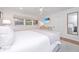 Bright main bedroom with neutral décor, a large window, and a view of the yard, creating a peaceful retreat at 1035 Planters Curve, Mount Pleasant, SC 29464