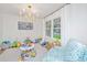 Bright playroom with toys, comfortable seating, and a chandelier, making it a fun and inviting space at 1035 Planters Curve, Mount Pleasant, SC 29464