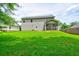 Large, lush backyard, and exterior view of a two-story home with siding at 1039 Steelechase Ln, Hanahan, SC 29410