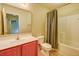 Bathroom featuring vanity with framed mirror, toilet, and shower with neutral tile at 1039 Steelechase Ln, Hanahan, SC 29410