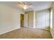 Bedroom featuring neutral carpet, paint, and trim; also includes a double door closet at 1039 Steelechase Ln, Hanahan, SC 29410
