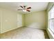 Bedroom featuring neutral carpet, paint, ceiling fan, and natural light at 1039 Steelechase Ln, Hanahan, SC 29410