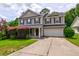 Charming two-story home with a well-manicured lawn and inviting curb appeal at 1039 Steelechase Ln, Hanahan, SC 29410