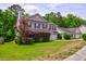 Beautiful two-story home with an attached garage and lush green lawn at 1039 Steelechase Ln, Hanahan, SC 29410